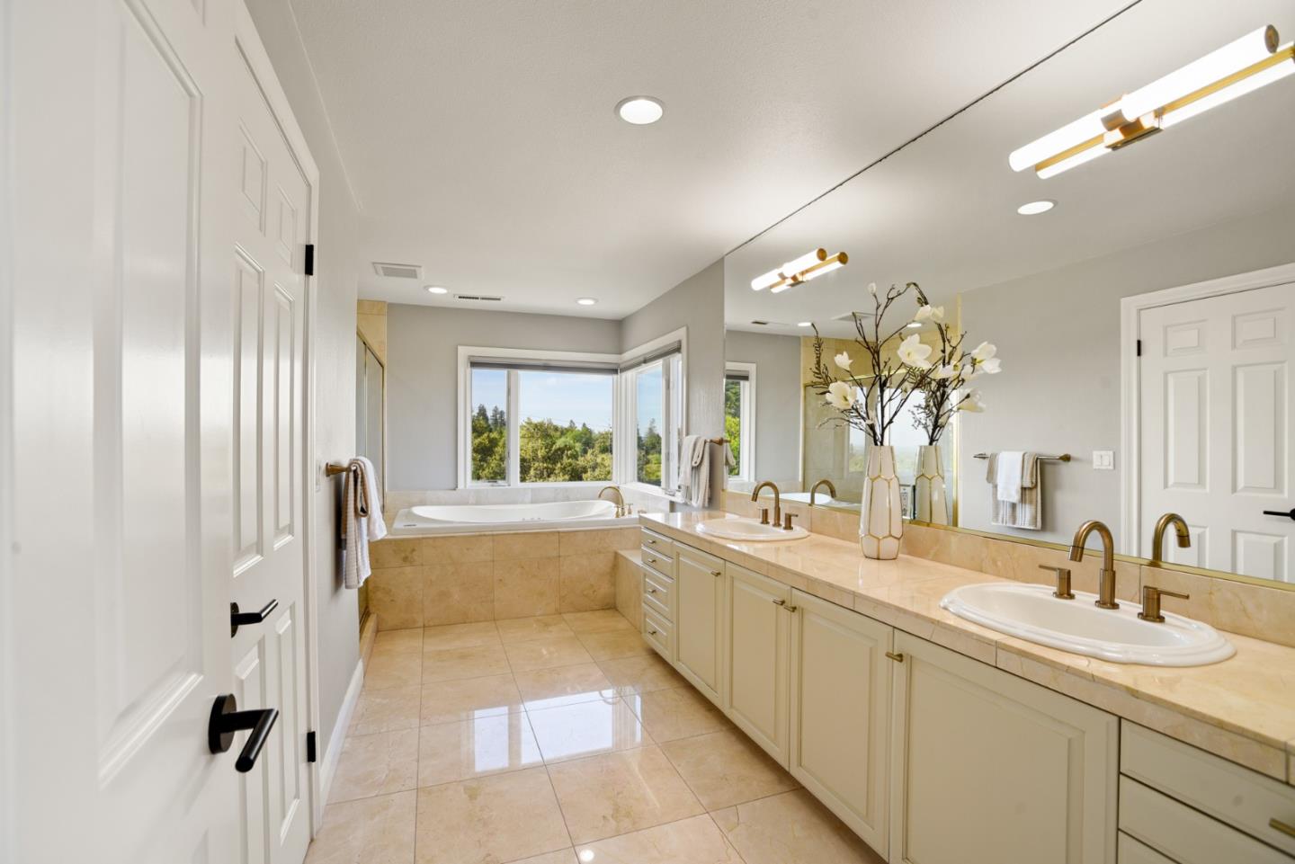18782 Withey Road Monte Sereno, CA 95030 - Photo 21 of 39 a large white bathroom with a large tub sink and mirror
