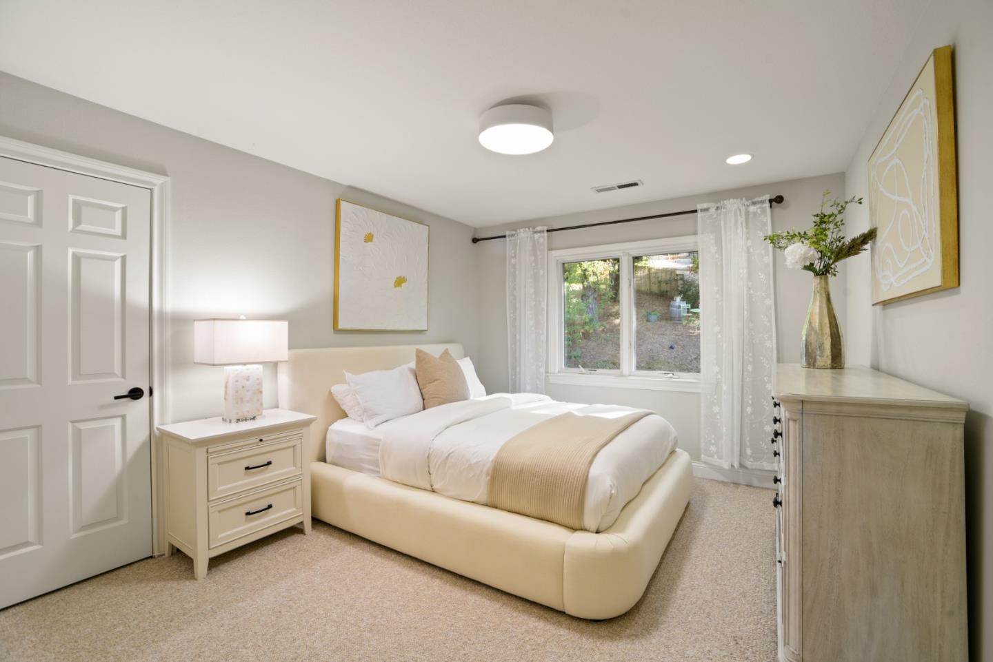 18782 Withey Road Monte Sereno, CA 95030 - Photo 23 of 39 a spacious bedroom with a large bed and a chandelier