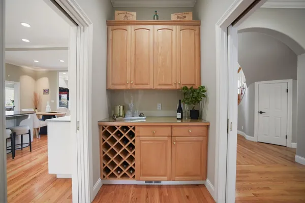 a view of a patio with table and chairs under an umbrella