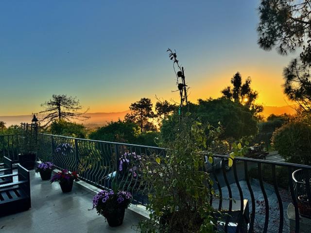 18782 Withey Road Monte Sereno, CA 95030 - Photo 36 of 39 a view of a balcony with chairs and potted plants
