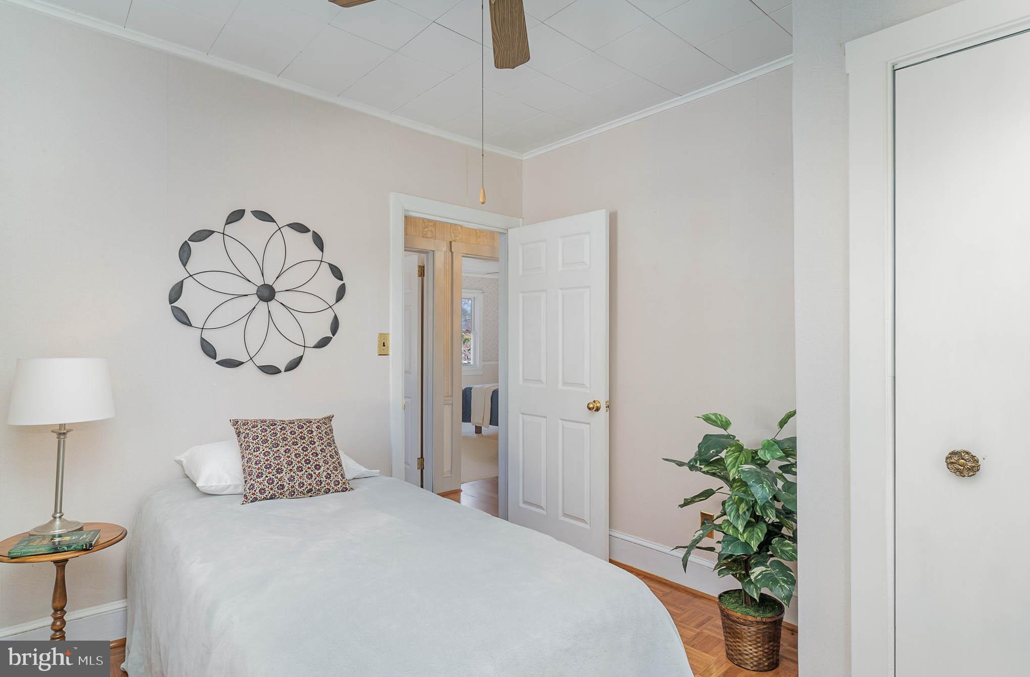 35 West 4th Avenue Lititz, PA 17543 - Photo 21 of 55 a bedroom with a large bed and a chandelier