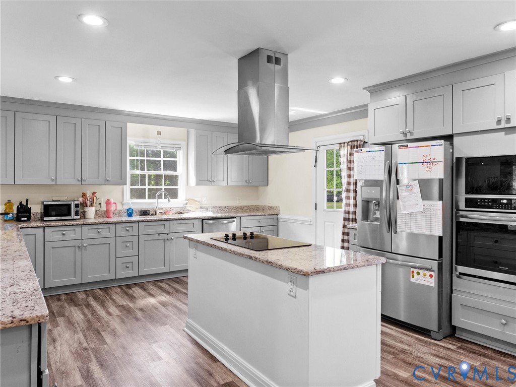 1920 Meadow Road Sandston, VA 23150 - Photo 12 of 46 a kitchen with kitchen island granite countertop a sink stove and refrigerator