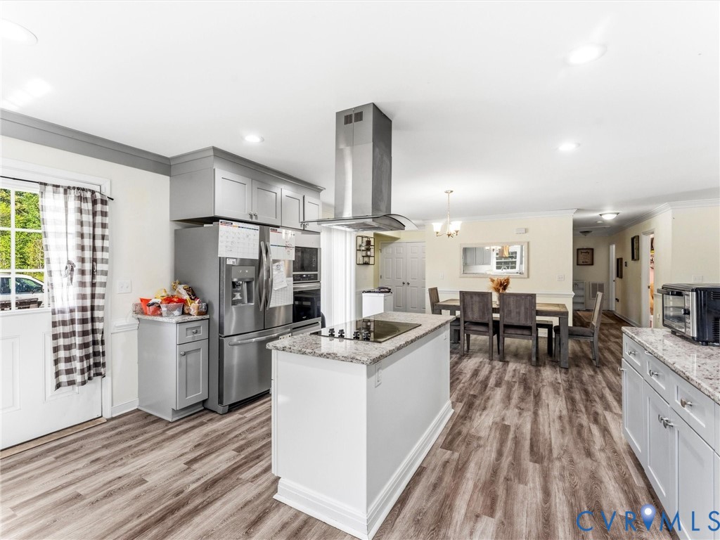 1920 Meadow Road Sandston, VA 23150 - Photo 15 of 46 a view of a kitchen with dining room and wooden floor