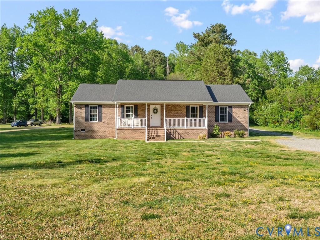 1920 Meadow Road Sandston, VA 23150 - Photo 2 of 46 a front view of a house with a garden