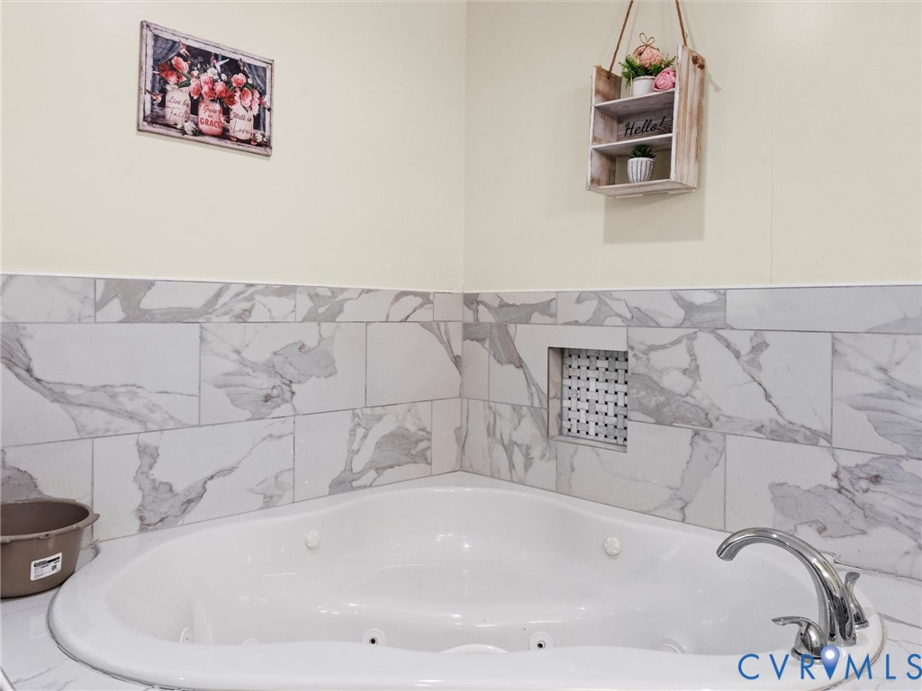 1920 Meadow Road Sandston, VA 23150 - Photo 30 of 46 a bathroom with a bathtub