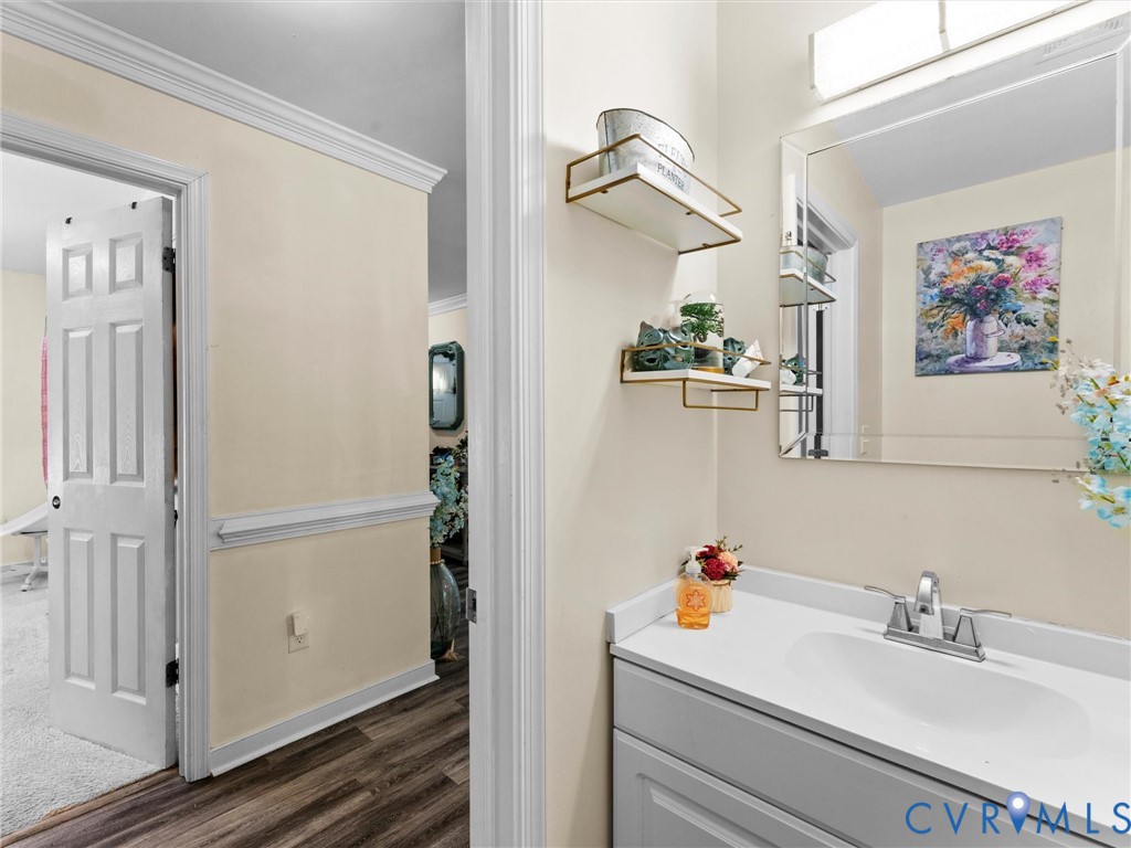 1920 Meadow Road Sandston, VA 23150 - Photo 32 of 46 a bathroom with a sink and mirror
