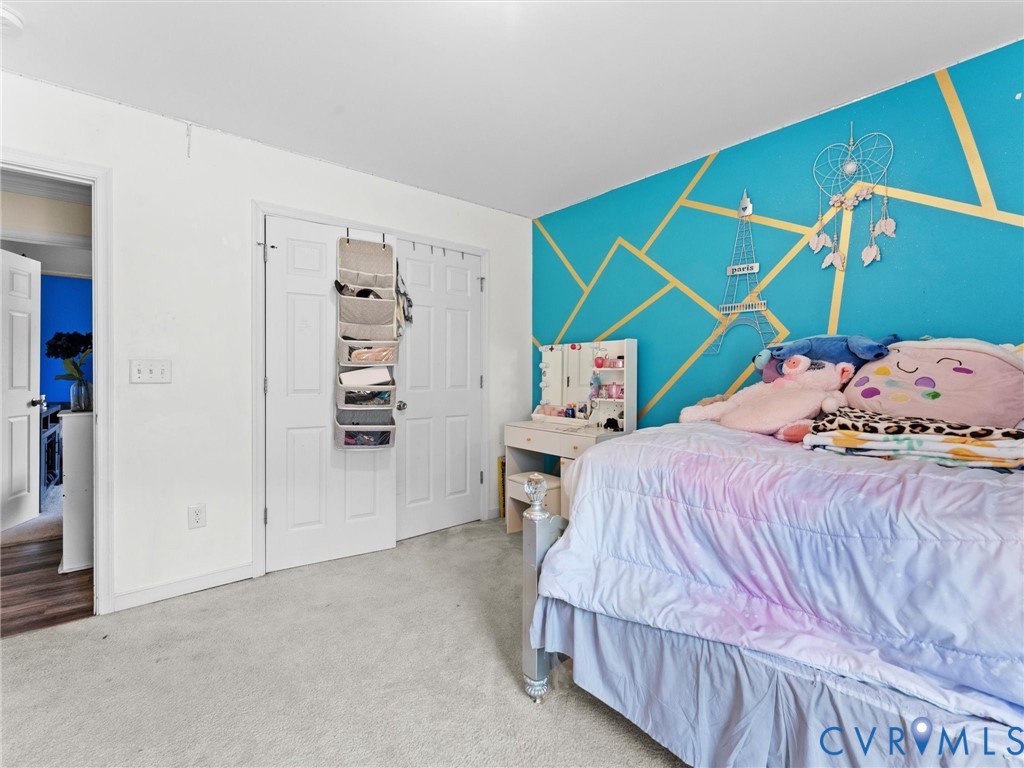 1920 Meadow Road Sandston, VA 23150 - Photo 36 of 46 a bedroom with a bed and a closet