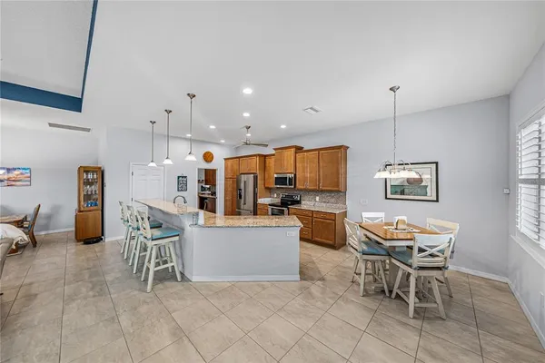 a dining room with furniture and window