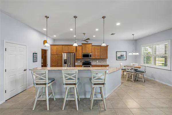 a utility room with sink dryer and washer