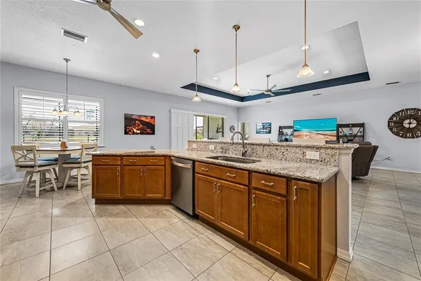 a bedroom with a bed and a flat tv screen on the dresser