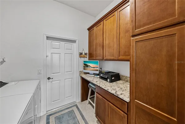 a bedroom with a bed and a lamp