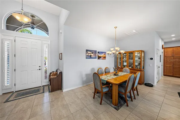 a living room with furniture a rug and a flat screen tv