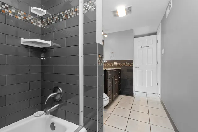 a bathroom with a sink and a shower