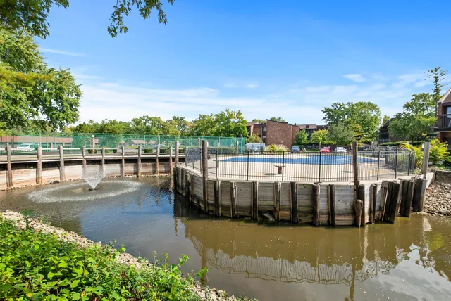 a view of swimming pool with outdoor seating