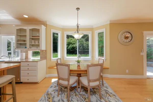 a dining room with furniture and window