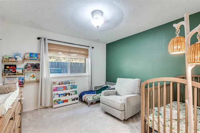 a bedroom with furniture and a window