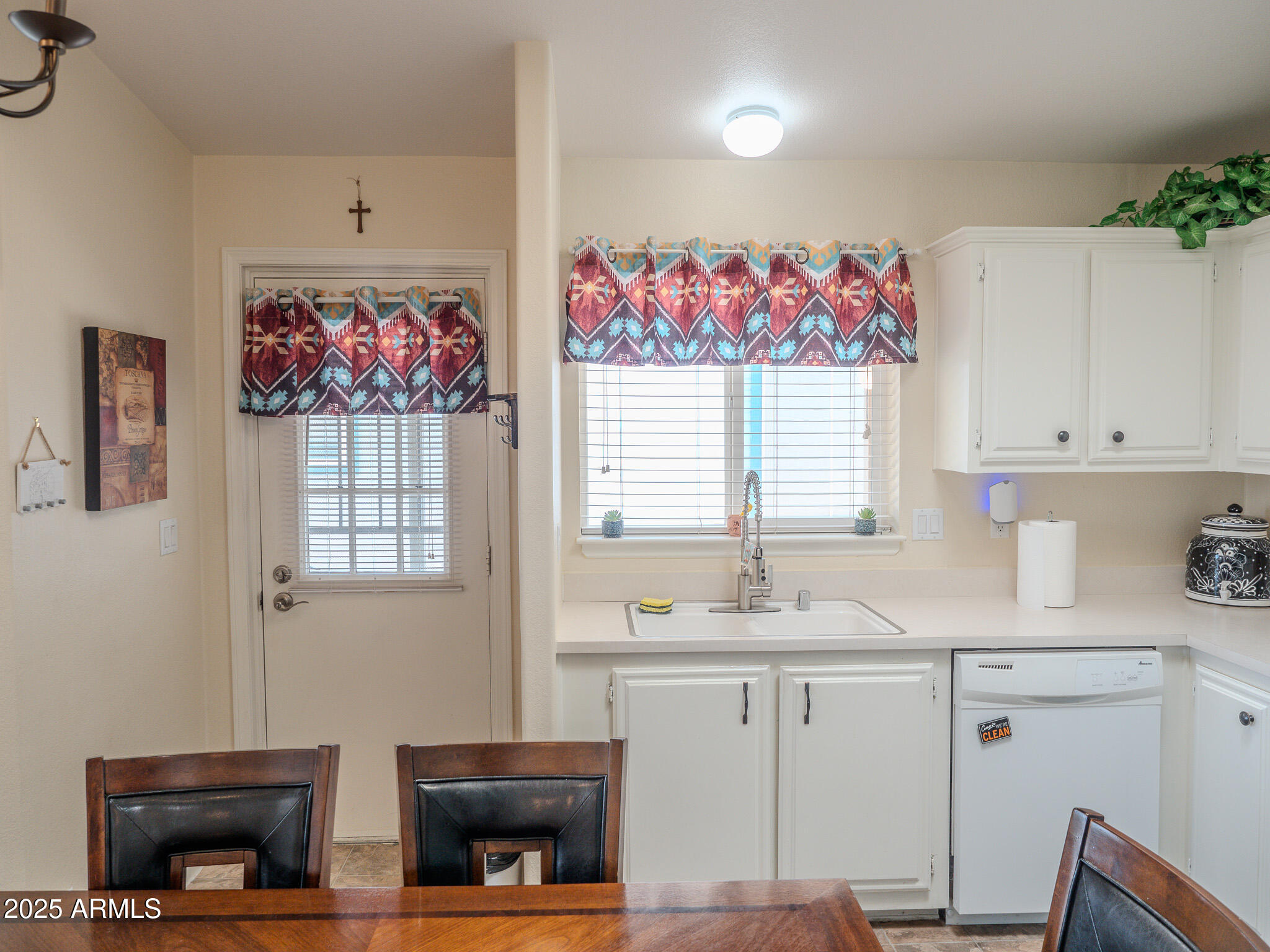 8865 East Baseline Road, Unit 1207 Mesa, AZ 85209 - Photo 15 of 40 a kitchen with cabinets a sink and a window