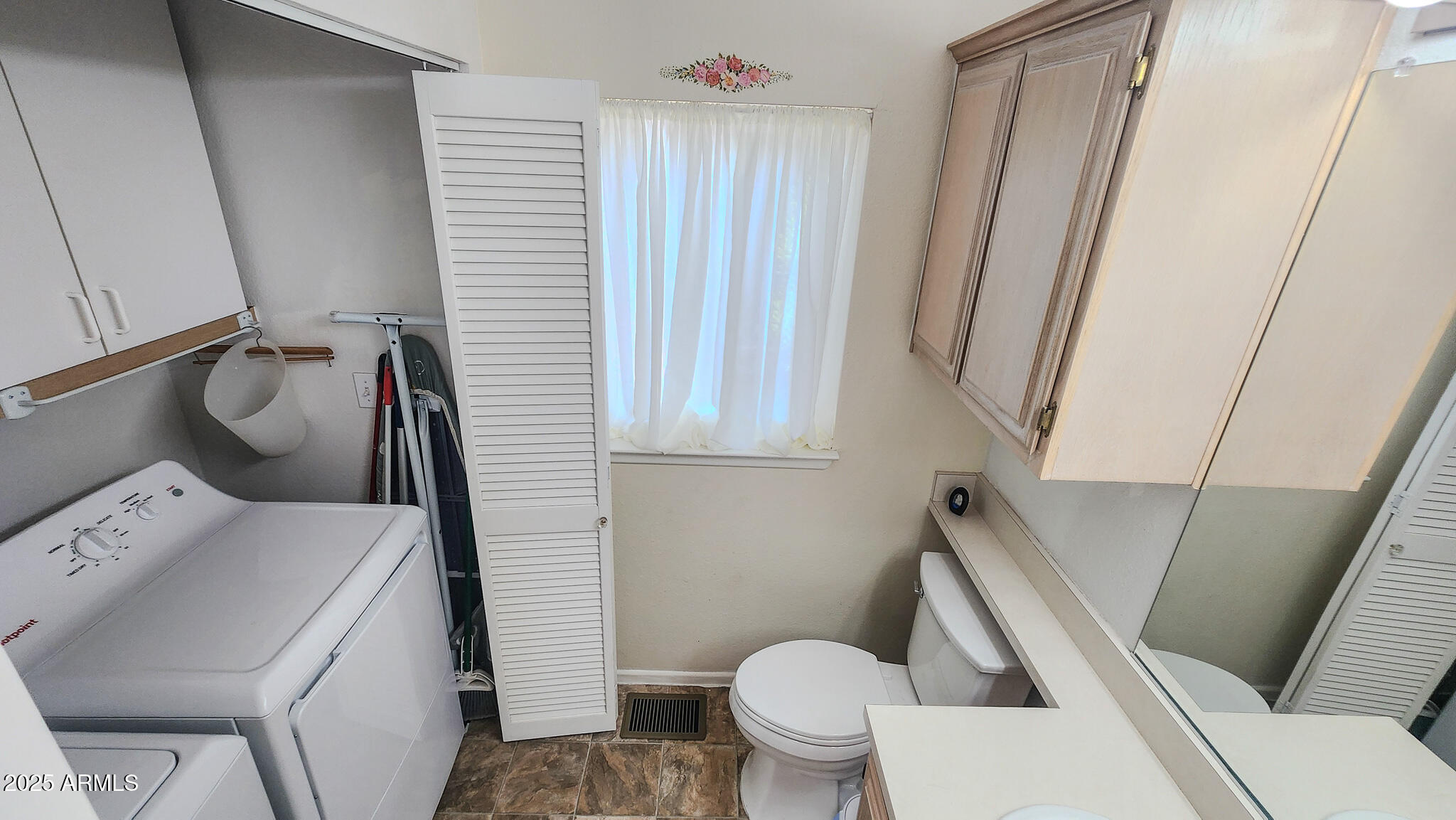 8865 East Baseline Road, Unit 1207 Mesa, AZ 85209 - Photo 24 of 40 a bathroom with a sink and toilet