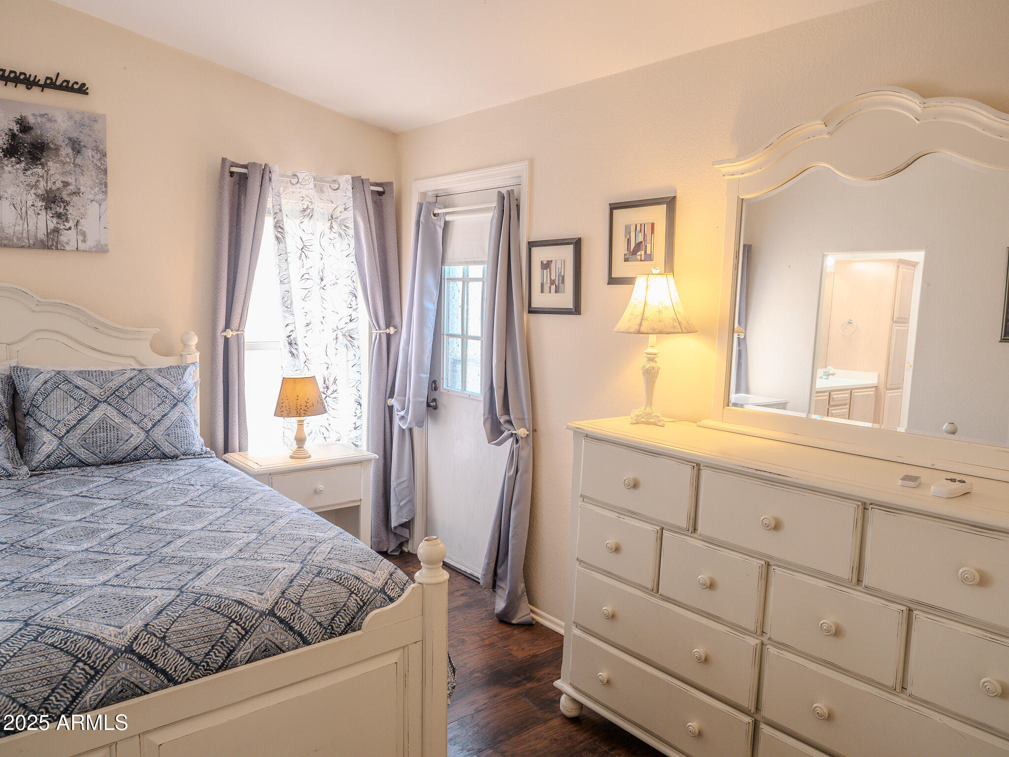 8865 East Baseline Road, Unit 1207 Mesa, AZ 85209 - Photo 27 of 40 a bedroom with a bed and a window