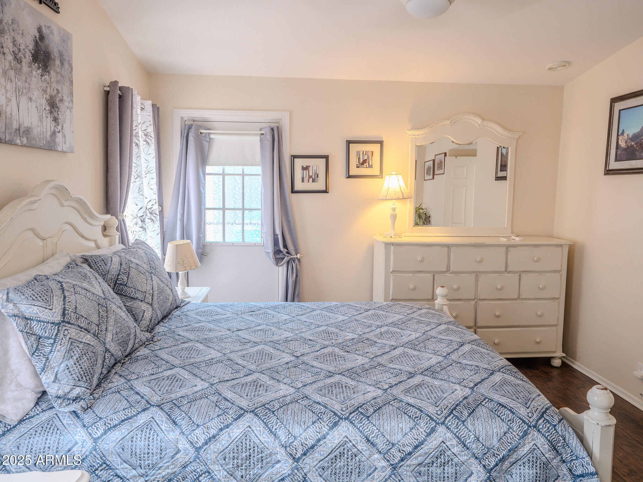 8865 East Baseline Road, Unit 1207 Mesa, AZ 85209 - Photo 28 of 40 a bedroom with a bed and a potted plant