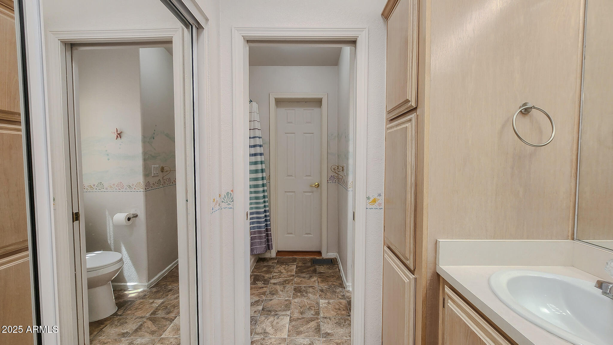 8865 East Baseline Road, Unit 1207 Mesa, AZ 85209 - Photo 34 of 40 a bathroom with a granite countertop toilet sink and shower