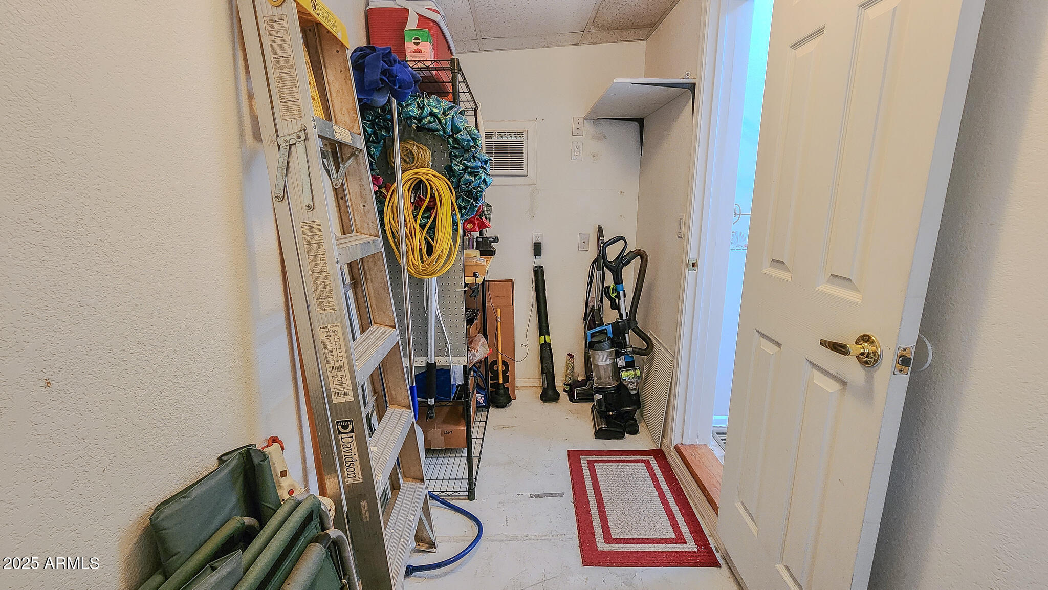8865 East Baseline Road, Unit 1207 Mesa, AZ 85209 - Photo 38 of 40 a view of walk in closet with clothes