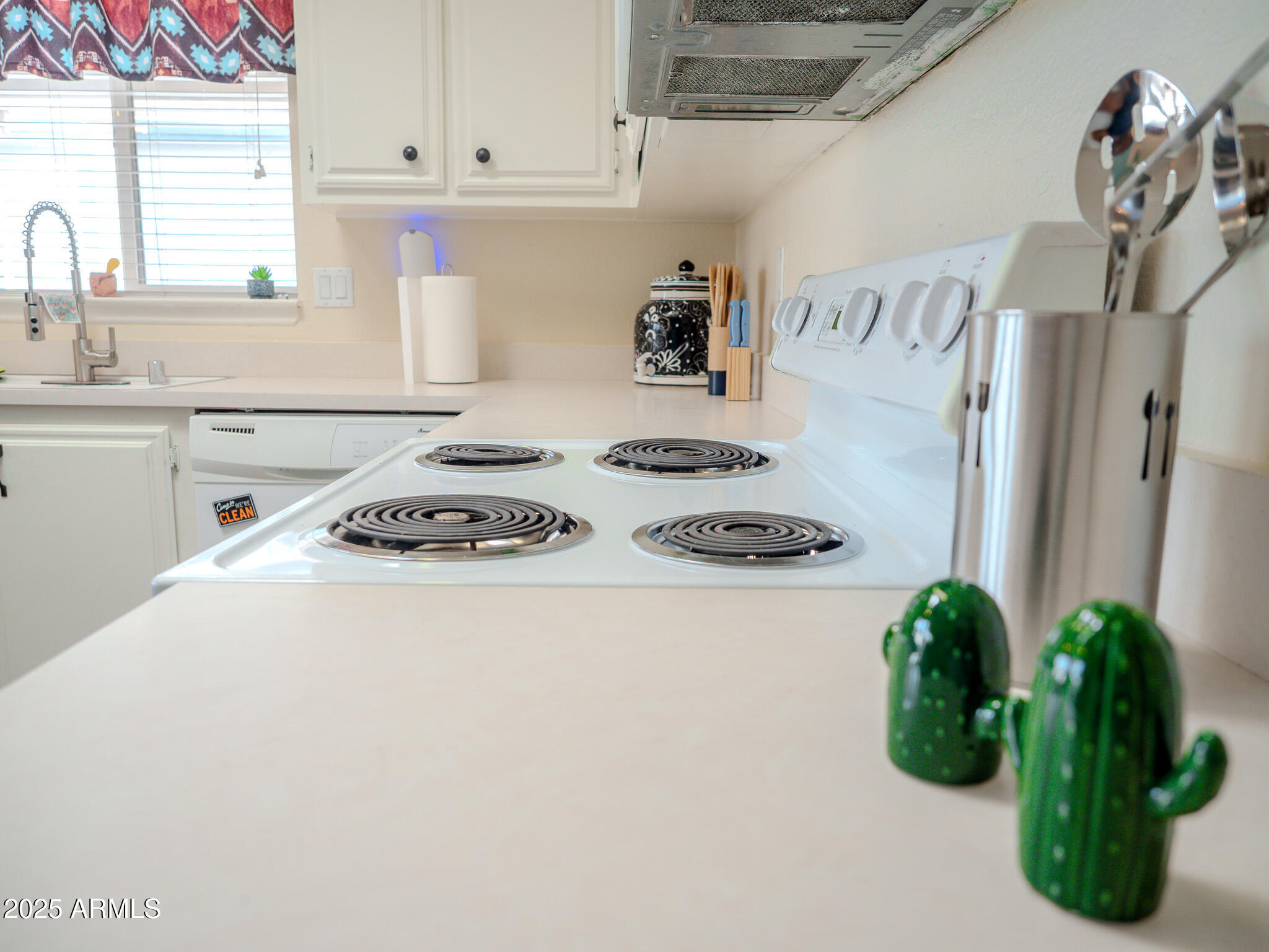 8865 East Baseline Road, Unit 1207 Mesa, AZ 85209 - Photo 40 of 40 a kitchen with a white stove top oven and a refrigerator