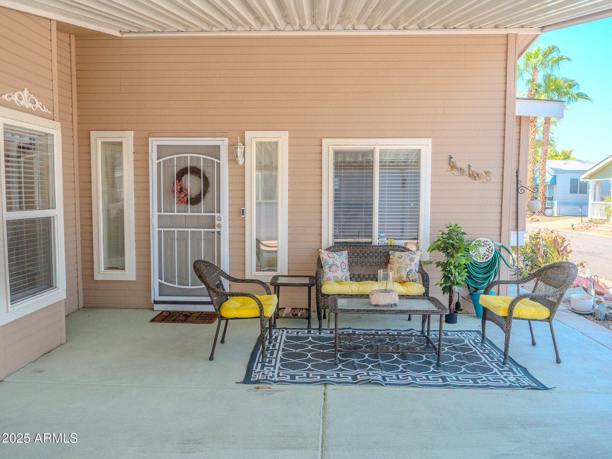 8865 East Baseline Road, Unit 1207 Mesa, AZ 85209 - Photo 7 of 40 a building outdoor space with patio furniture