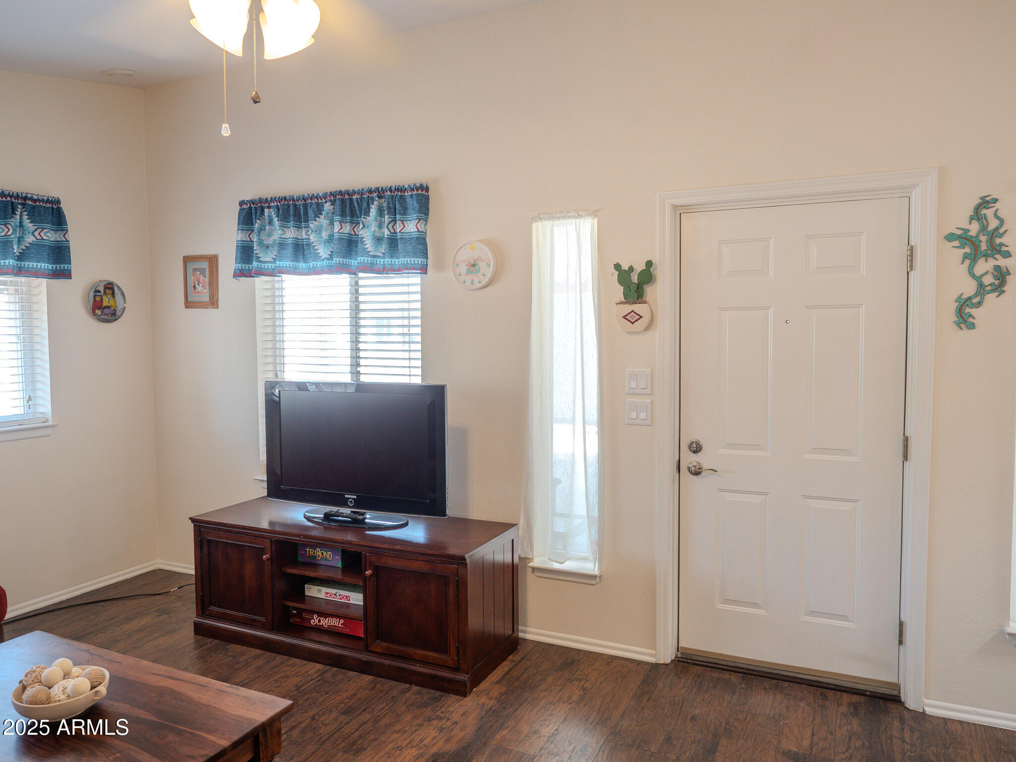 8865 East Baseline Road, Unit 1207 Mesa, AZ 85209 - Photo 9 of 40 a living room with furniture and flat screen tv