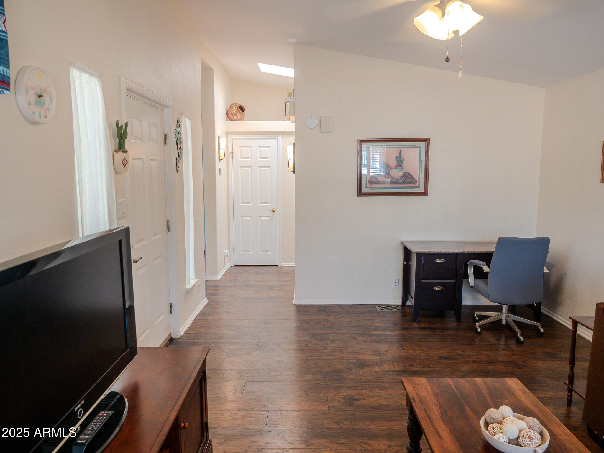 8865 East Baseline Road, Unit 1207 Mesa, AZ 85209 - Photo 10 of 40 a view of a livingroom with furniture and a flat screen tv