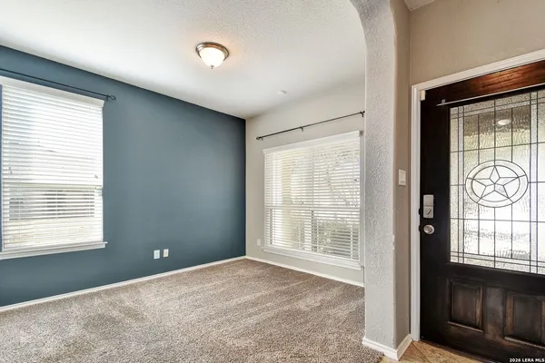 a view of an empty room with a window