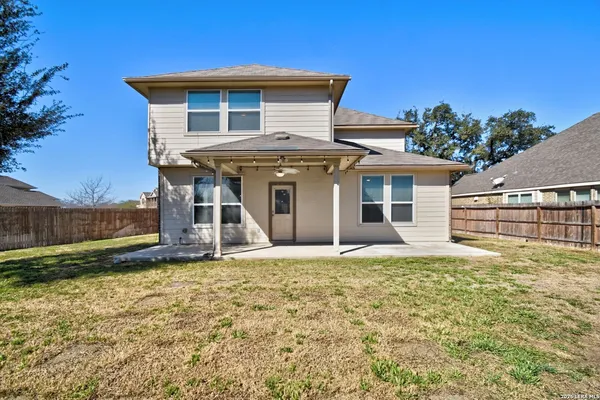 a house that has a large window in front of it