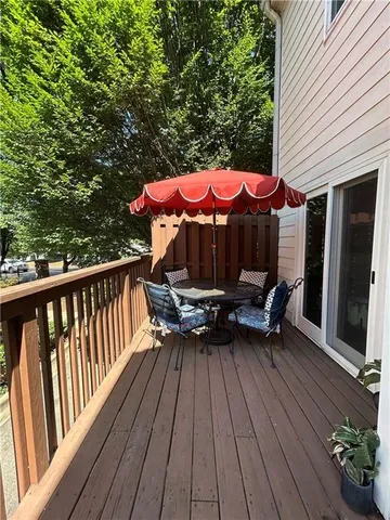 a view of a patio with a table and chairs