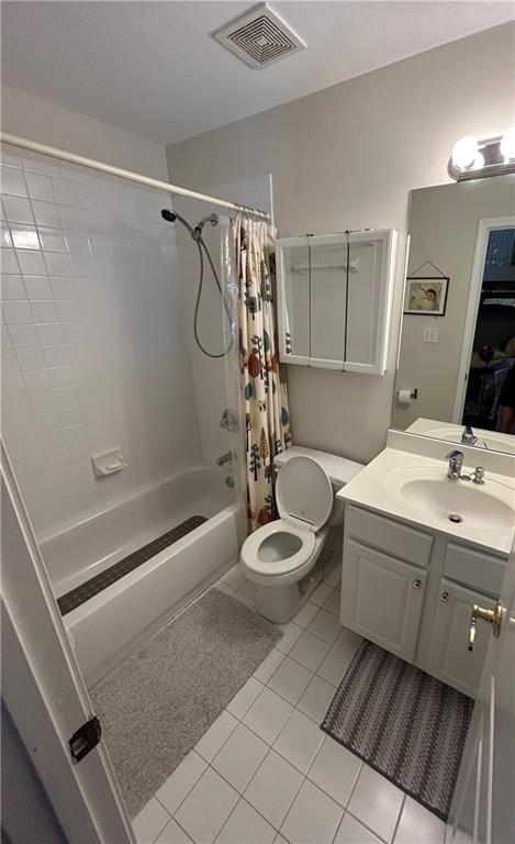 1580 Commerce Drive, Unit B1 Decatur, GA 30030 - Photo 18 of 19 a bathroom with a double vanity sink a toilet a shower and a mirror