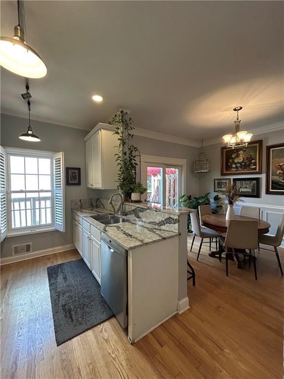 1580 Commerce Drive, Unit B1 Decatur, GA 30030 - Photo 3 of 19 a kitchen with stainless steel appliances granite countertop a stove and a wooden floors