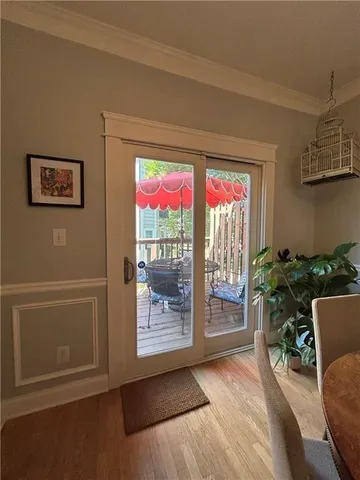 a room with furniture and a potted plant
