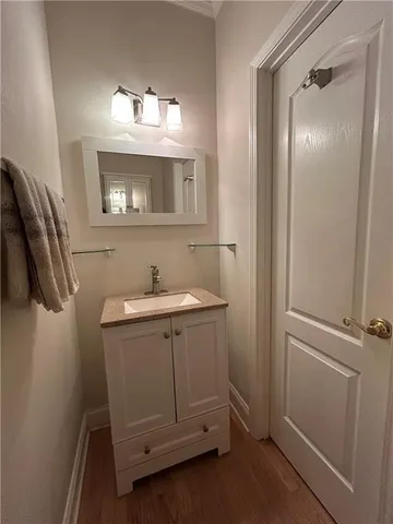 a bathroom with a sink a mirror and shower