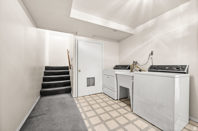 1650 Nichole Circle Sandy, UT 84093 - Photo 20 of 31 Dedicated laundry area featuring a utility sink and patterned floor tiling