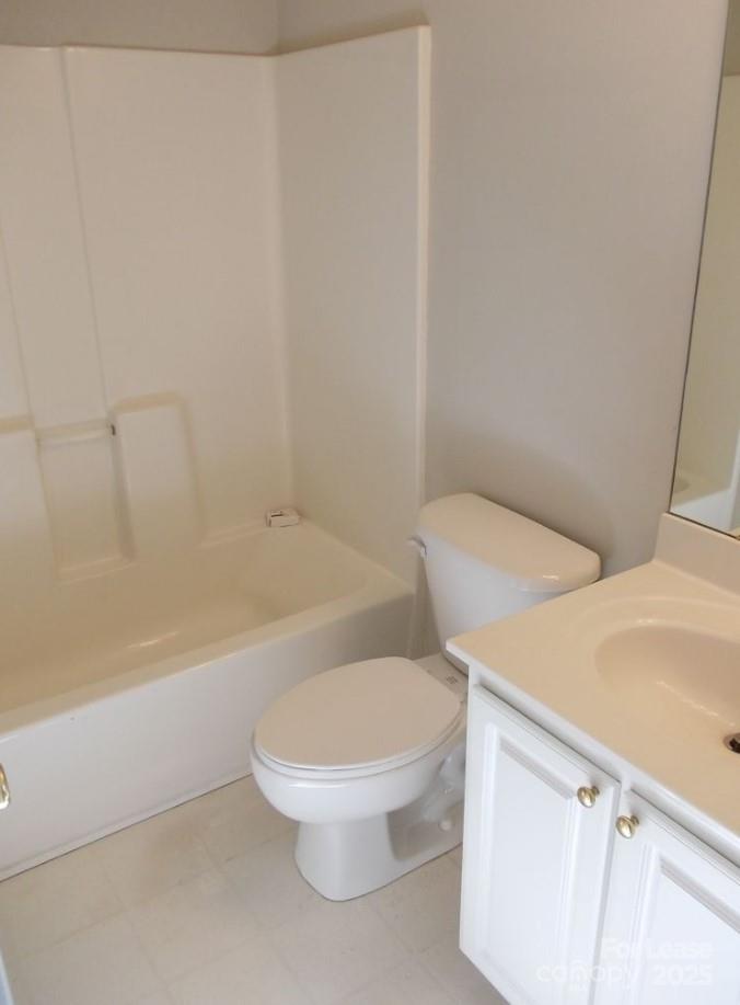 12317 Paperbark Circle Charlotte, NC 28277 - Photo 16 of 23 a white toilet and tub next to a sink