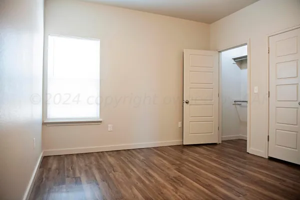 a view of bathroom with a sink and a mirror