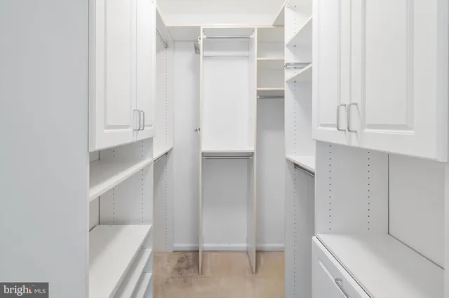 a view of an empty walk in closet