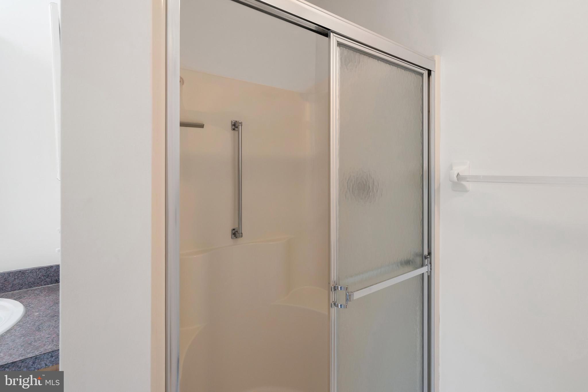 12 Rye Court Jackson, NJ 08527 - Photo 17 of 32 a bathroom with a glass shower door