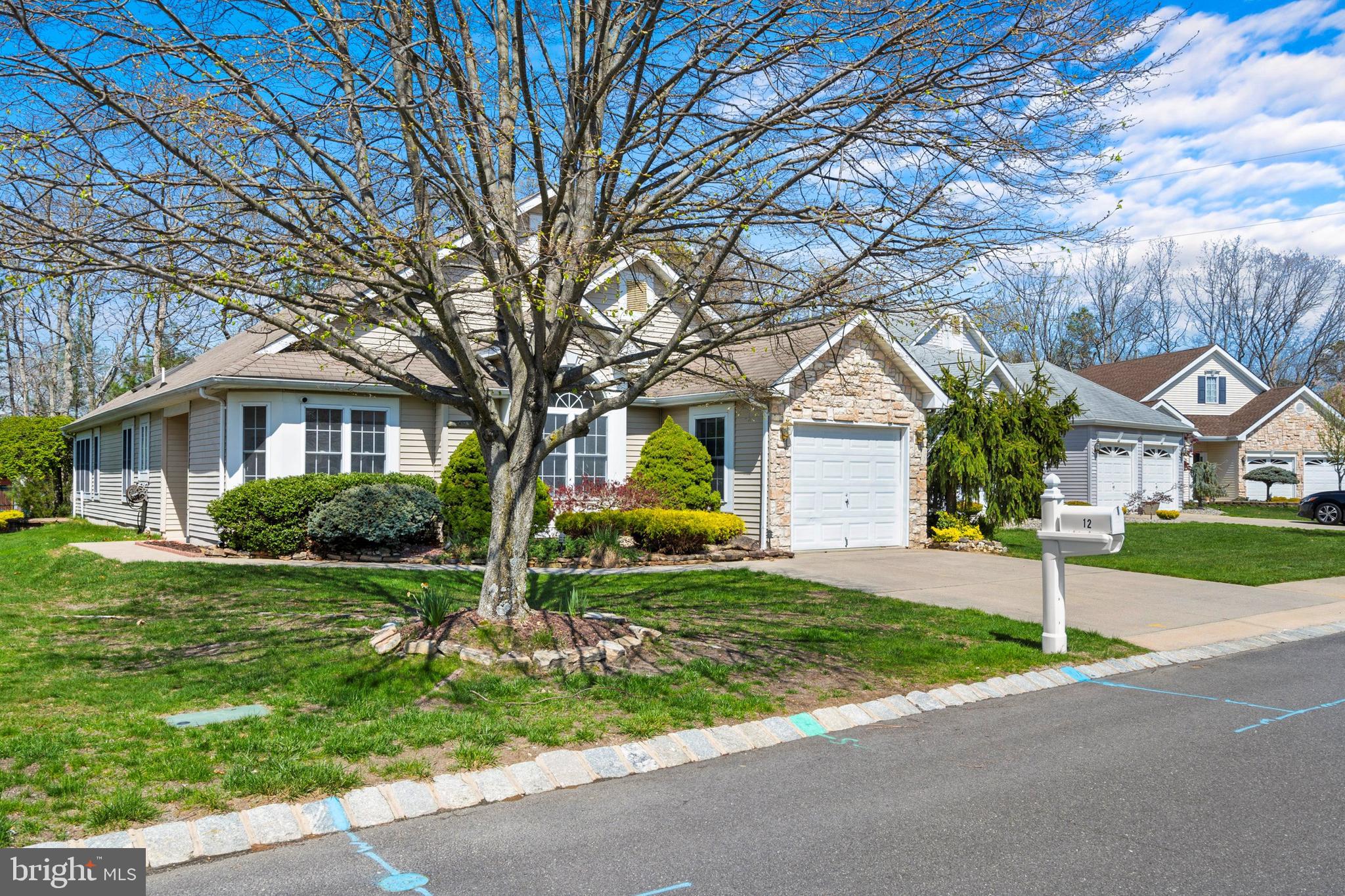 12 Rye Court Jackson, NJ 08527 - Photo 2 of 32 a front view of a house with a yard and garage