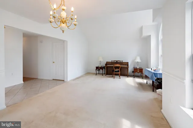 a view of a livingroom with furniture and chandelier
