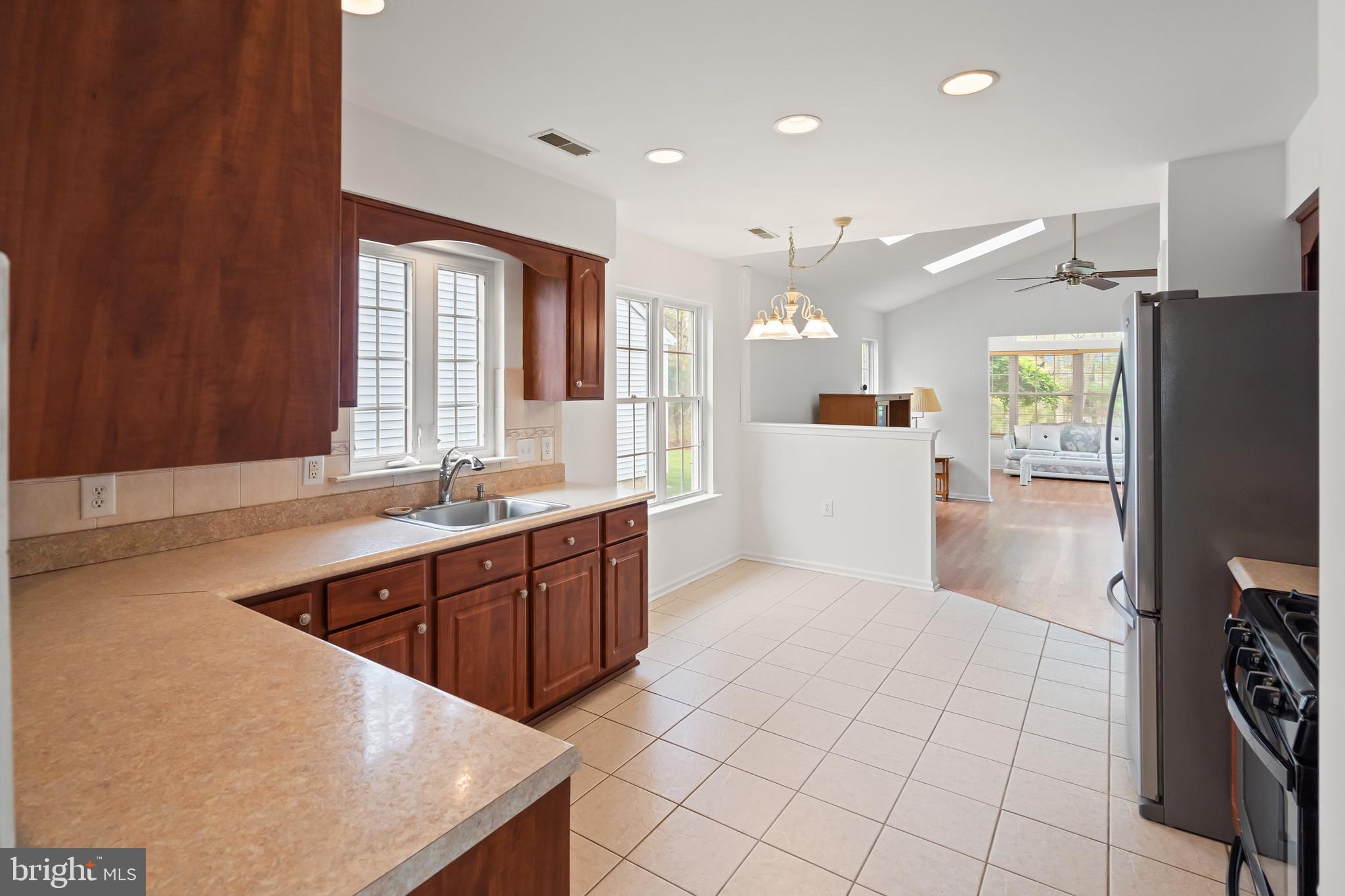 12 Rye Court Jackson, NJ 08527 - Photo 8 of 32 a large kitchen with stainless steel appliances a large counter top a refrigerator and a sink