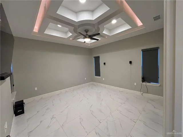 a bathroom with a granite countertop sink a mirror and a shower