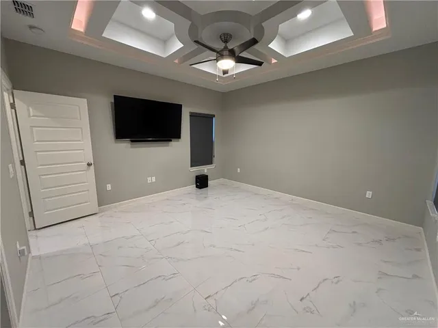 a spacious bathroom with a granite countertop sink a mirror and a shower