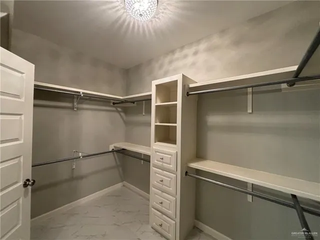 a bathroom with a sink toilet and a mirror