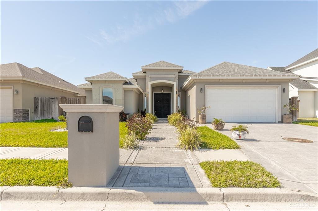 2601 Tulipan Avenue Mission, TX 78574 - Photo 2 of 27 a front view of a house with a yard