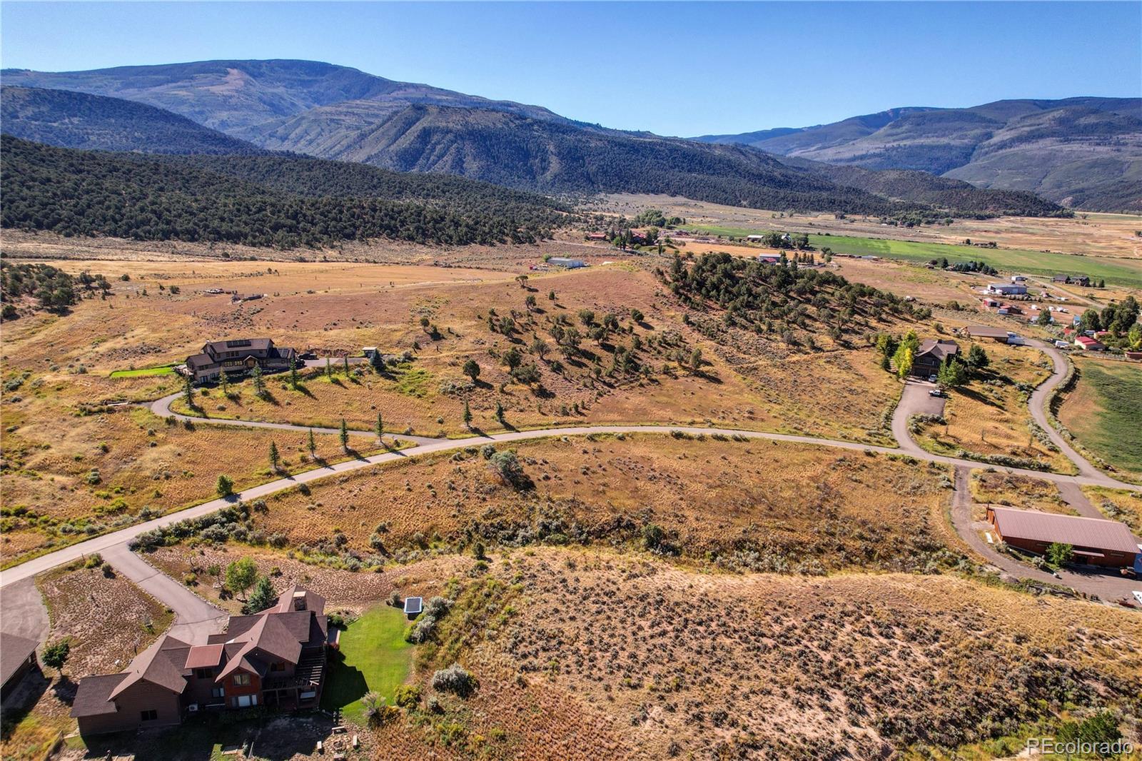 230 Amherst Road Gypsum, CO 81637 - Photo 6 of 19 a view of a backyard with a mountain